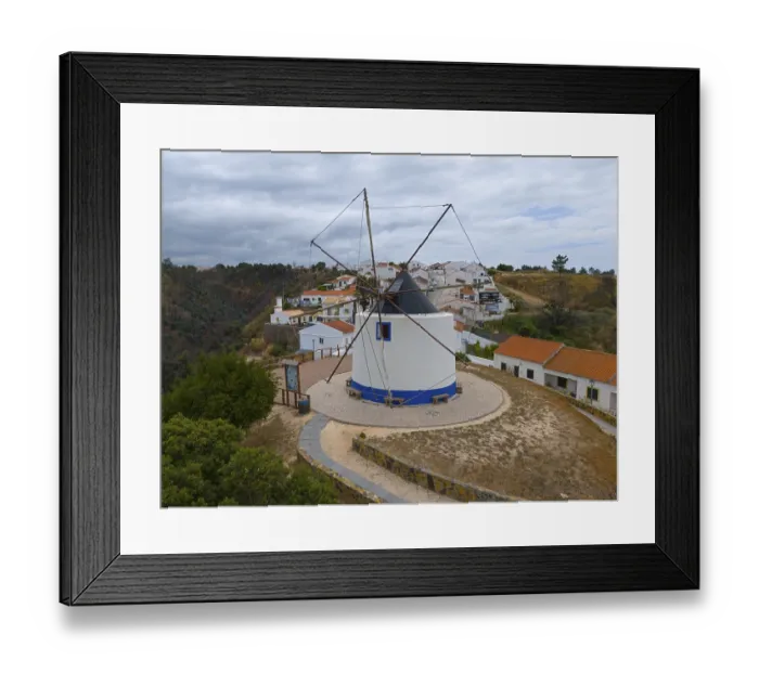 Framed Print : Aerial view of a windmill in the middle of a village Framed Print : Aerial view of a windmill in the middle of a village