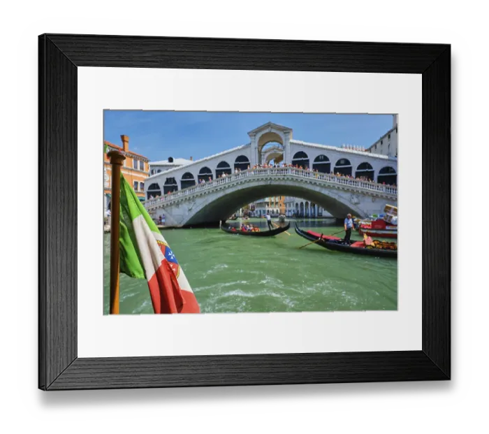 Framed Print : Italian maritime flag with Rialto bridge with boats and gondolas in the bacground