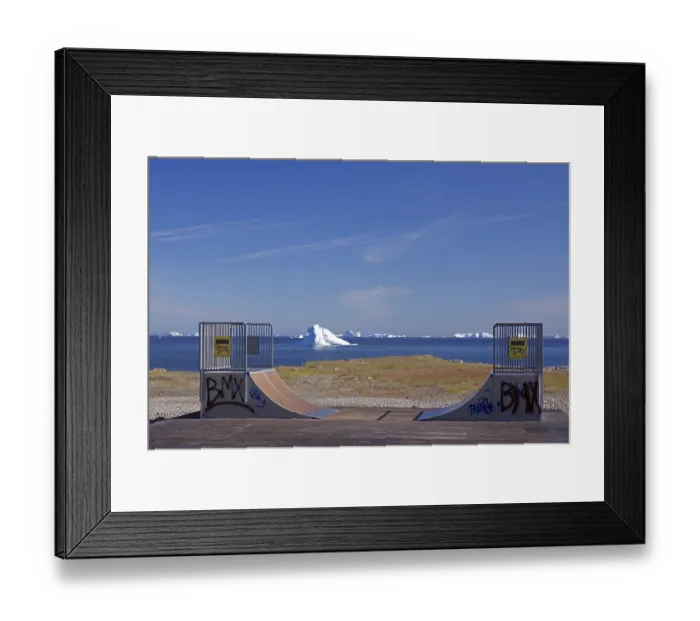 Framed Print : Skating rink painted with graffiti in front of icebergs floating in a bay