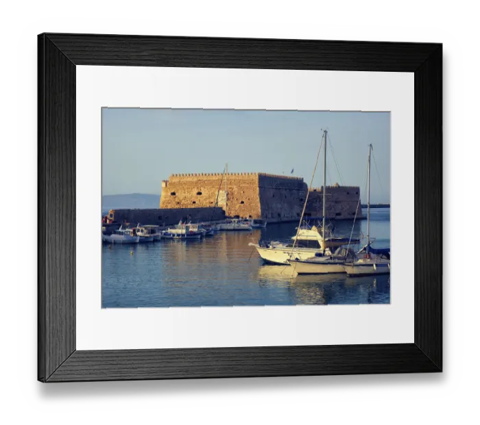 Framed Print : Venetian Fort castle in Heraklion and moored fishing boats