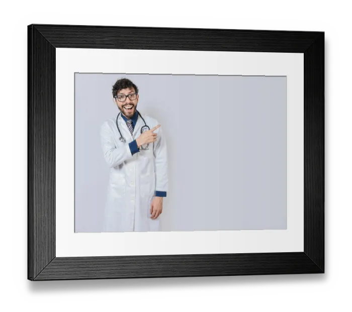 Framed Print : Young doctor pointing a promotion with finger Framed Print : Young doctor pointing a promotion with finger
