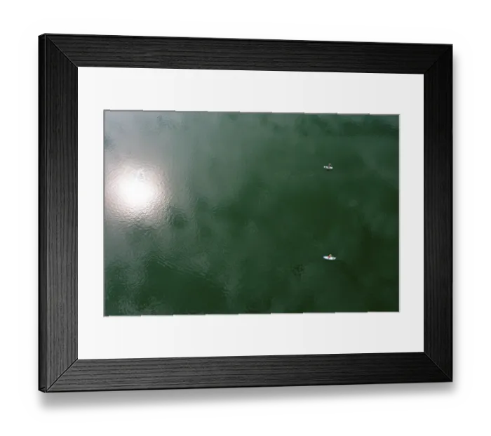 Framed Print : Drone shot, from above, sun reflection in the water with stand up paddler at the Irrsee Framed Print : Drone shot, from above, sun reflection in the water with stand up paddler at the Irrsee