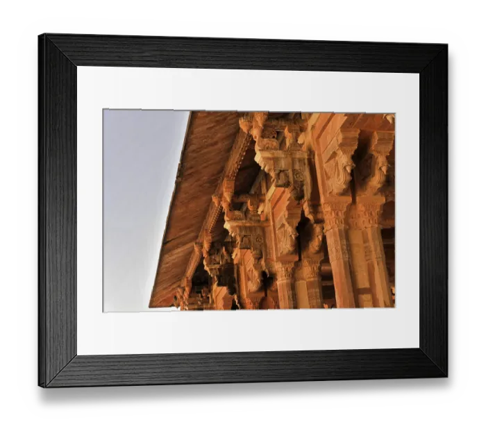 Framed Print : Complex design of architectural ornaments and a stone roof on a historic building