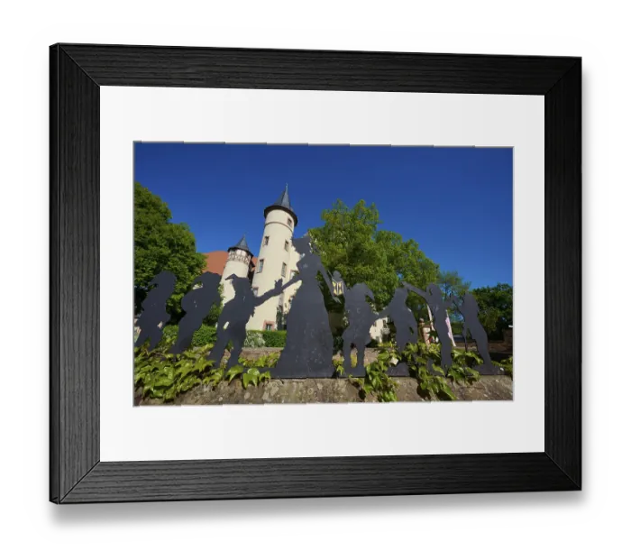 Framed Print : Silhouettes of Snow White and the Seven Dwarfs in front of a castle with round towers