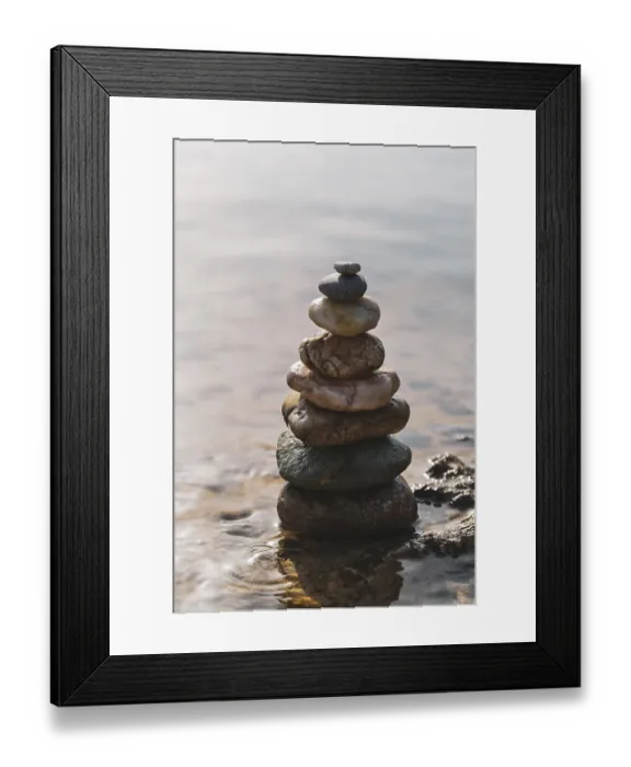 Framed Print : Pyramid of stones on the seashore zen balance
