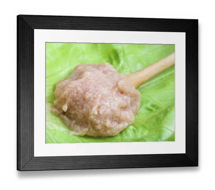Framed Print : Salty caviar of zander fish in wooden spoon on green leaf close up