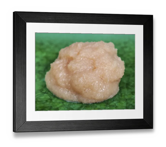 Framed Print : Handful of salty caviar of cod fish on green plate