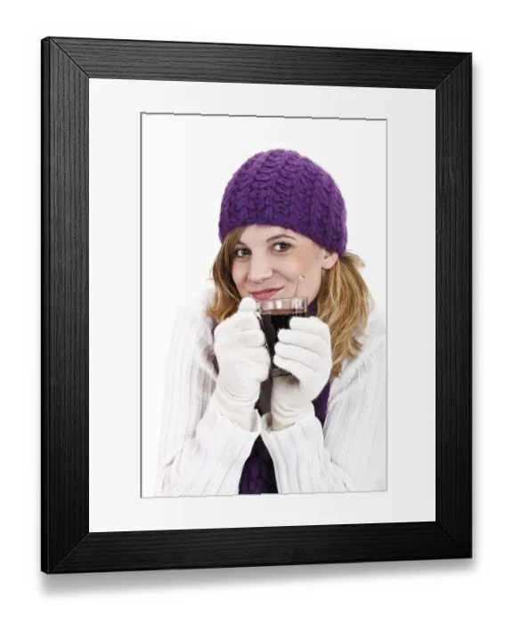 Framed Print : Young woman holding a glass of mulled wine