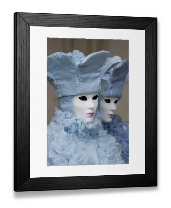 Framed Print : Two people wearing ice-blue costumes and masks