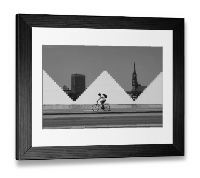 Framed Print : Cyclist in front of white wall