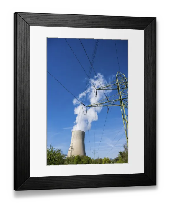 Framed Print : A cooling tower of the Gosgen nuclear power plant in Switzerland emitting steam into a clear blue sky Framed Print : A cooling tower of the Gosgen nuclear power plant in Switzerland emitting steam into a clear blue sky