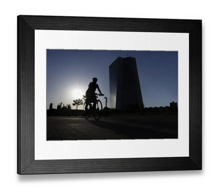 Framed Print : A cyclist, his silhouette silhouetted against the sun Framed Print : A cyclist, his silhouette silhouetted against the sun