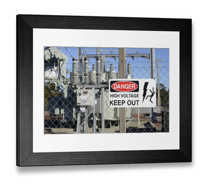 Framed Print : Signage warns people against high voltage accessing an electrical sub-station