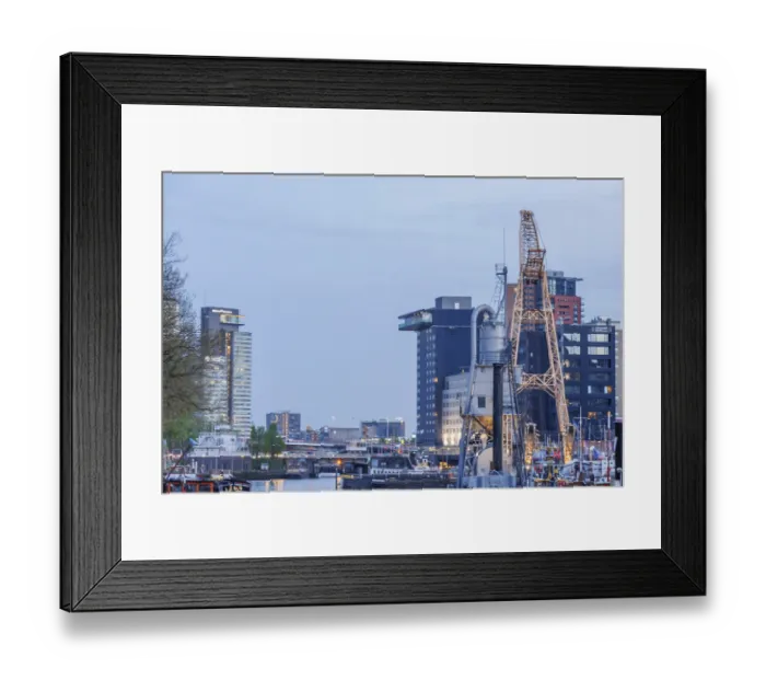 Framed Print : Modern and traditional structures stretch along the harbour at dusk