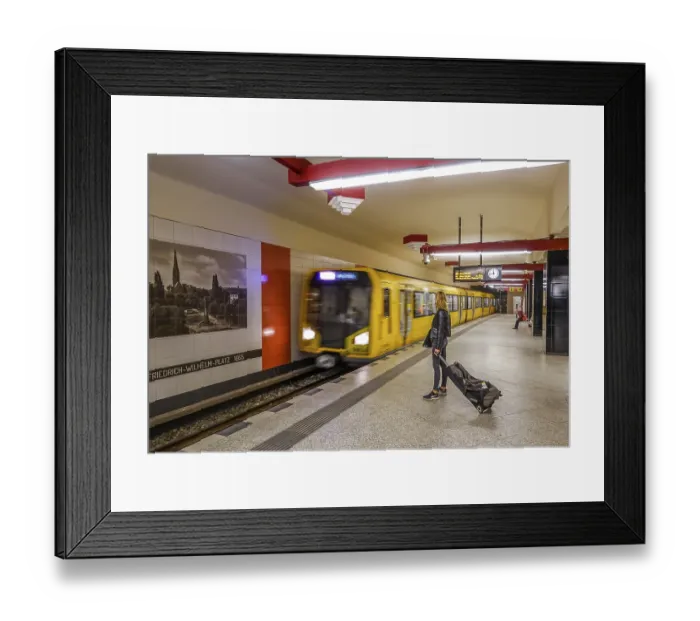 Framed Print : Woman with suitcase waiting for arriving underground