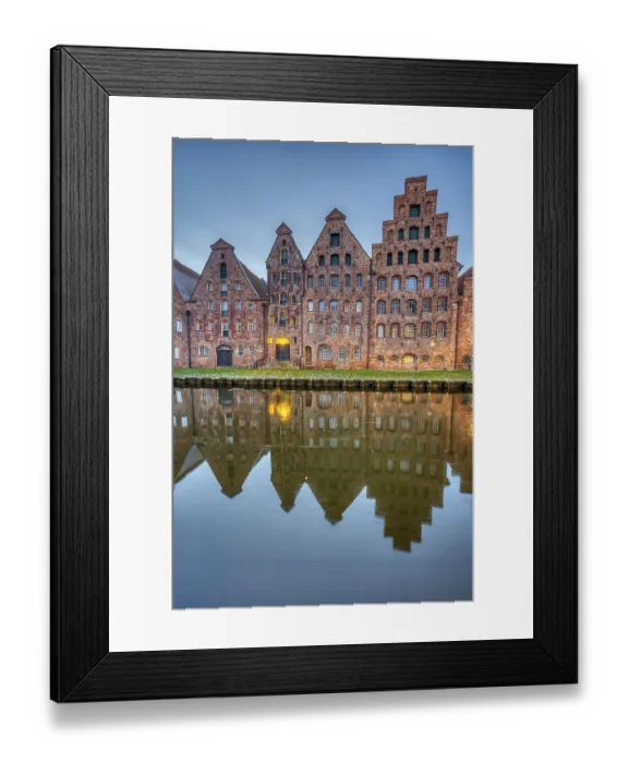 Framed Print : The medieval salt warehouse with the river Trave at dawn Framed Print : The medieval salt warehouse with the river Trave at dawn