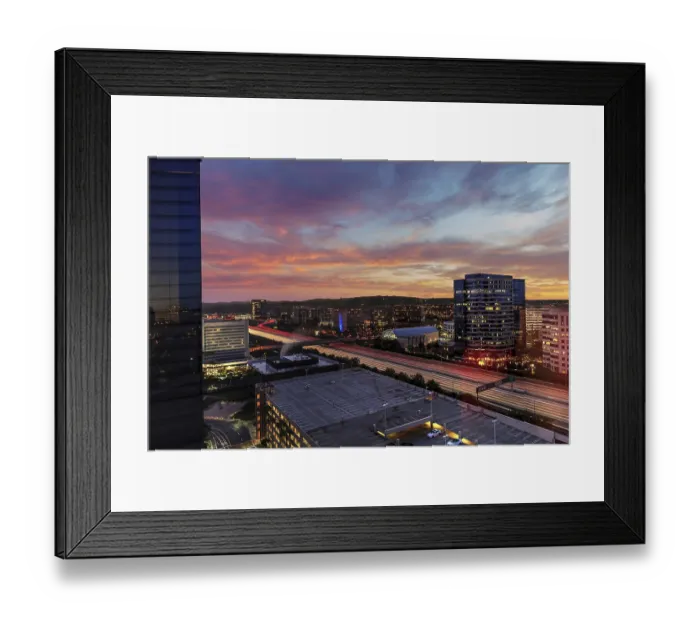 Framed Print : Sunrise over light trails and city lights on a highway in Irvine