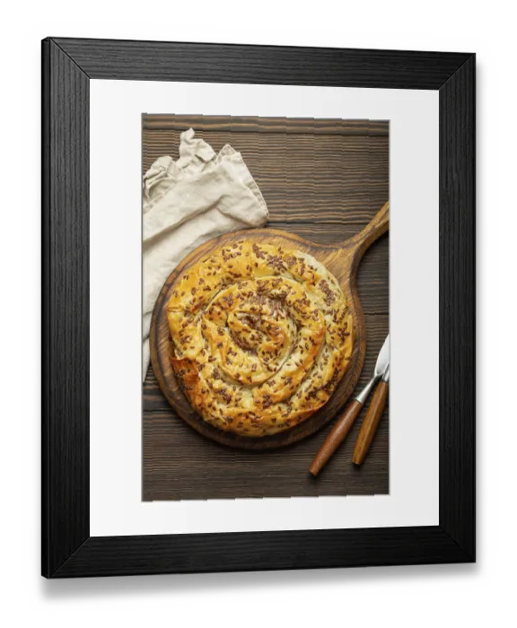 Framed Print : Burek made of phyllo dough with filling on cutting board