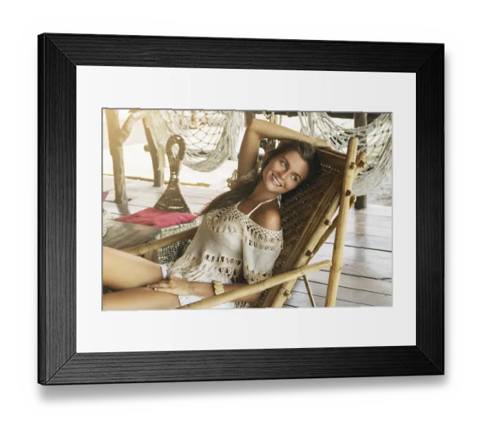 Framed Print : Woman sitting and relaxing in the wooden armchair Framed Print : Woman sitting and relaxing in the wooden armchair
