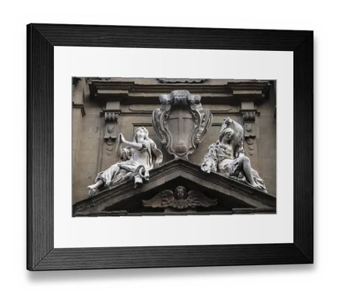 Framed Print : Statues of Hope and Poverty seated either side of the arms of the Theatine order over the central door on the facade of Framed Print : Statues of Hope and Poverty seated either side of the arms of the Theatine order over the central door on the facade of