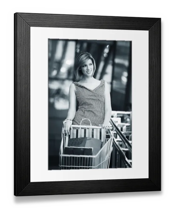 Framed Print : Beautiful blonde with shopping cart near supermarket