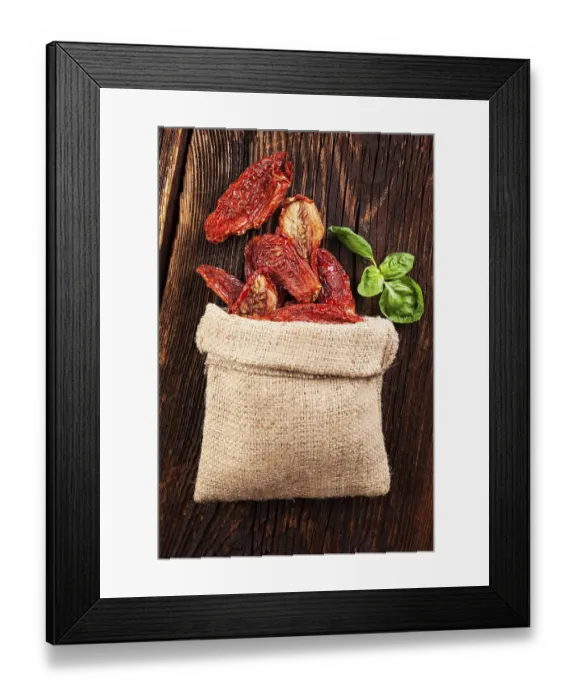 Framed Print : Delicious dried tomatoes on brown wooden vintage textured background