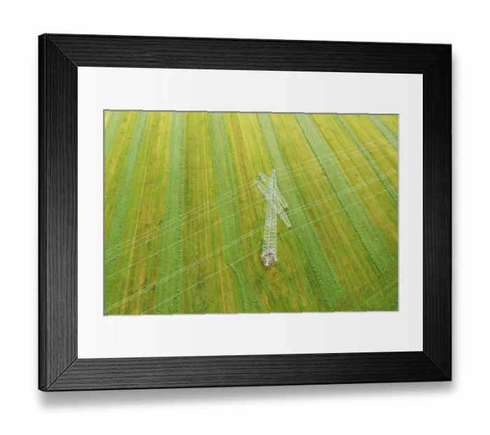 Framed Print : High voltage pylon, power line on green field near Dietramszell