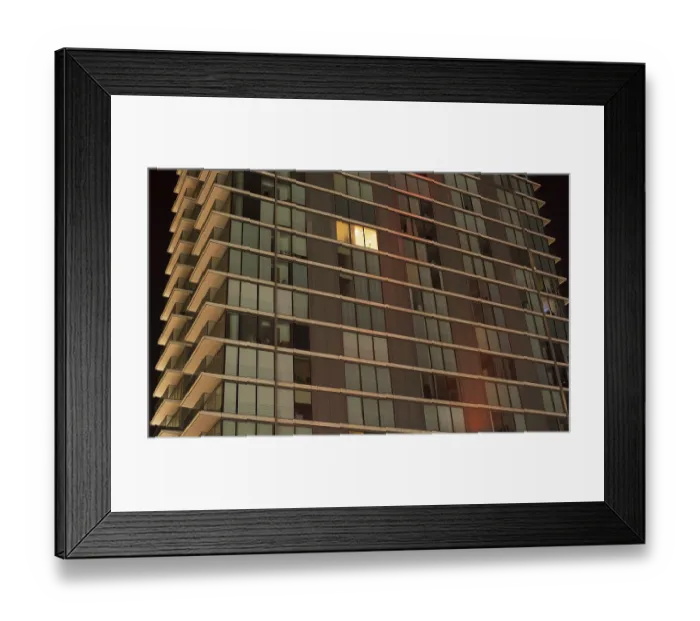 Framed Print : Single lit window in a modern apartment
