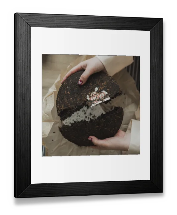 Framed Print : Hands skillfully breaking apart a beautiful tea cake