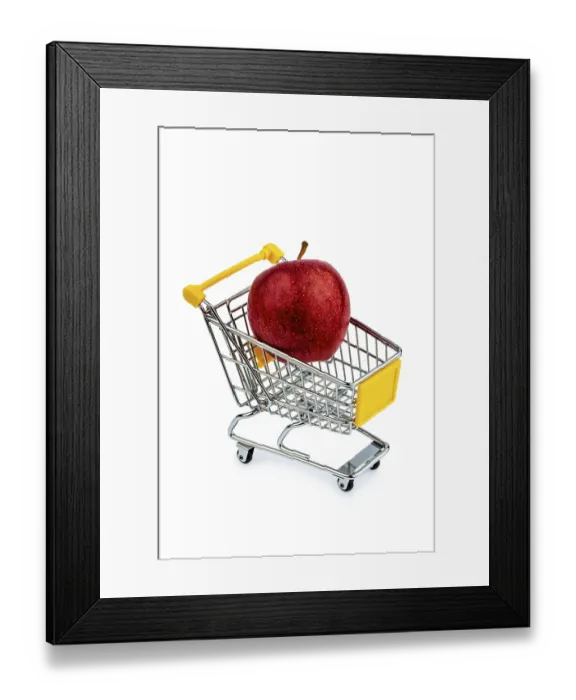 Framed Print : An apple lies in a shopping trolley