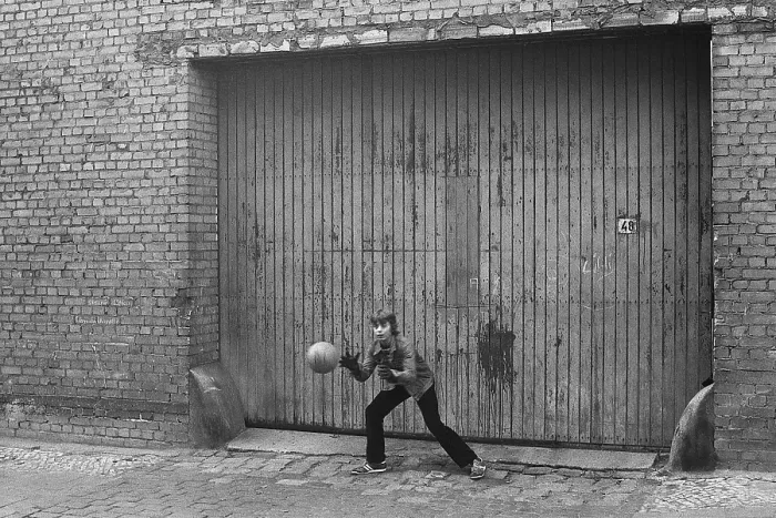 Framed Print : 07.12.1981, East Berlin, district Prenzlauer Berg, Kopenhagener Strasse, young goalkeeper catches the ball in a gateway East Berlin, Berlin-Prenzlauer Berg, GDR GDR