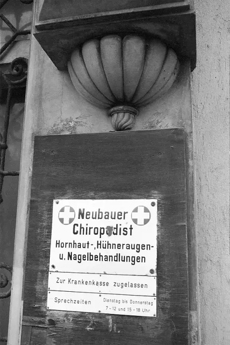 Framed Print : 17 November 1981, East Berlin, Prenzlauer Berg district, Chiropodist's practice sign at the entrance to a house in Poplar Avenue East Berlin, Berlin-Prenzlauer Berg, GDR GDR