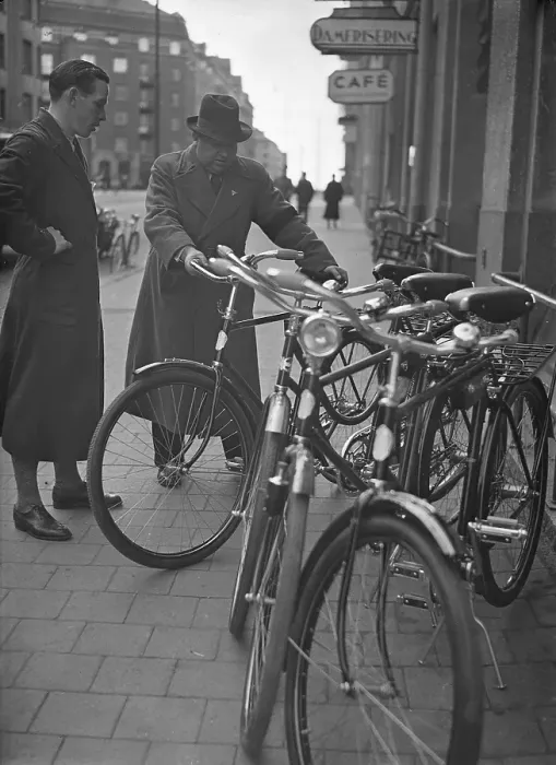 Framed Print : 1940s bicycle shop. The Swedish athlete and olympic cyclist champion Ingvar Eriksson outside his own bicycle shop where he sells and repairs bicycles. World War II has made petrol and oil expensive and rationed