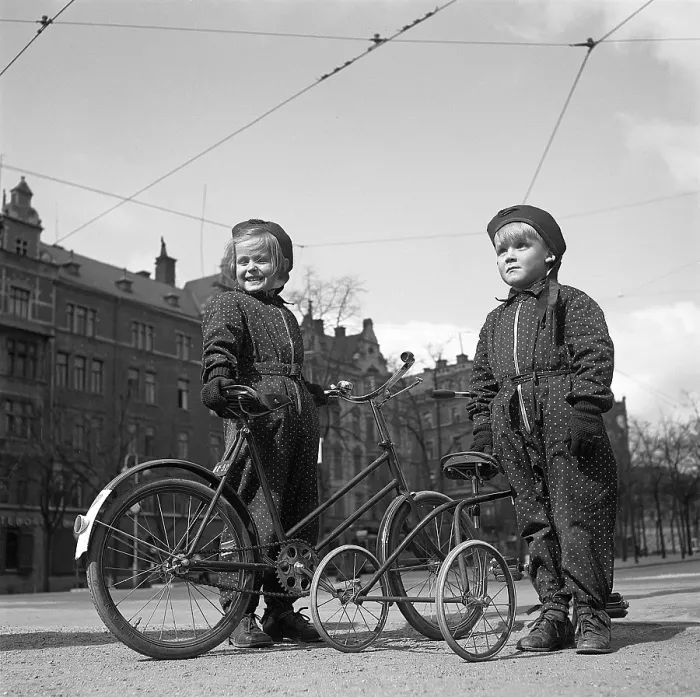 Framed Print : 1940s children. Two children are outside with their bicycles