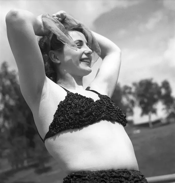 Framed Print : 1940s summer. A young woman in a bikini top