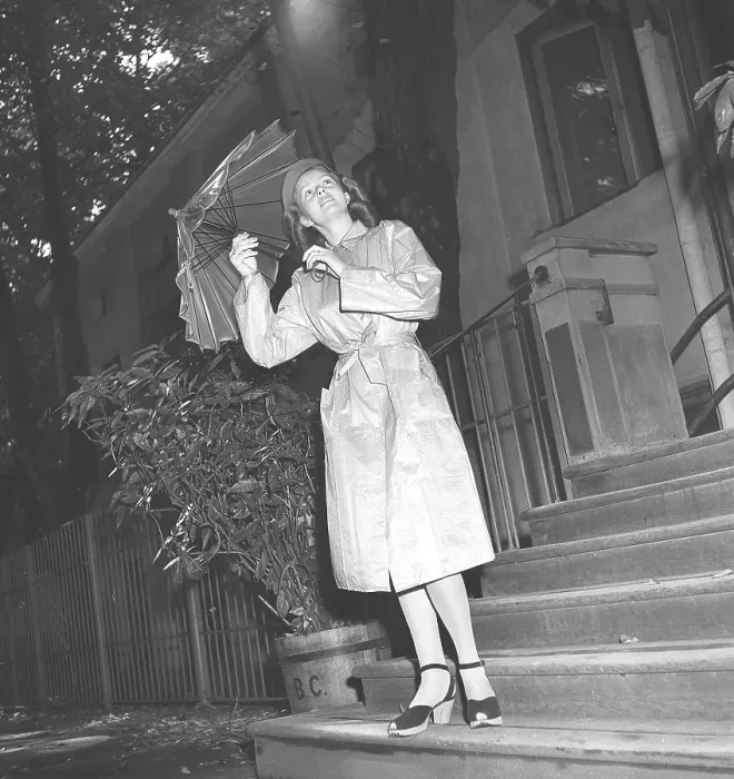 Framed Print : 1940s woman in raincoat Framed Print : 1940s woman in raincoat