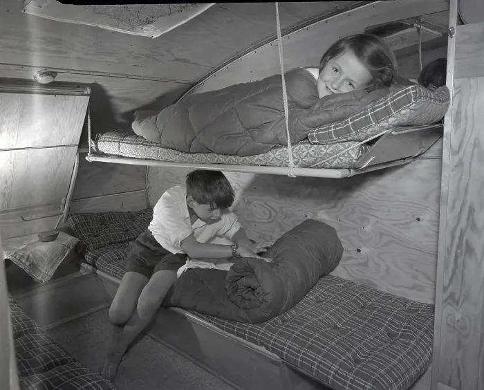 Framed Print : 1950s camping. A family is enjoying their holiday and the practial camping life in their caravan