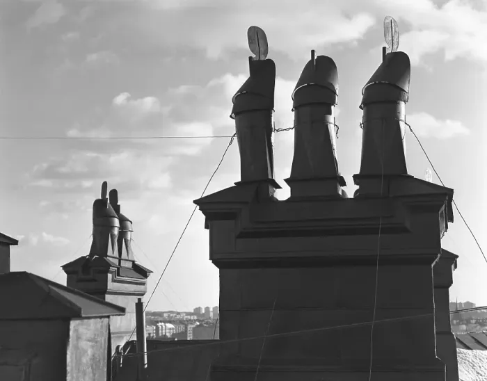 Framed Print : In the 1950s. Detail of chimneys on a rooftop in Stockholm Sweden