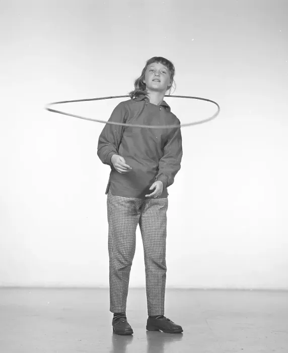 Framed Print : In the 1950s. A girl Hula hooping