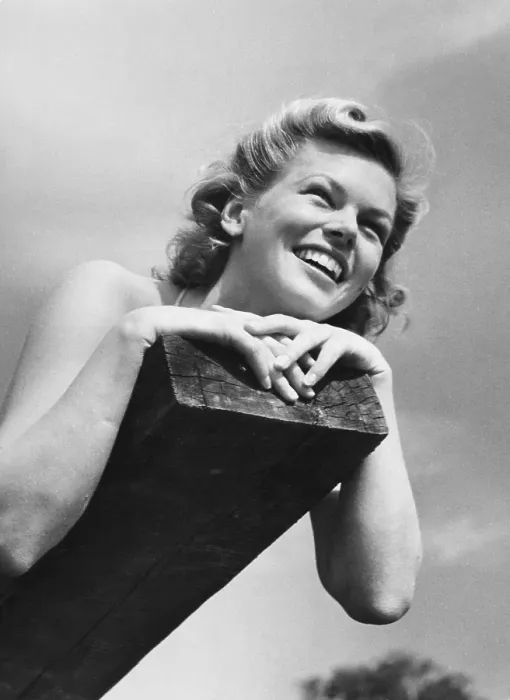 Framed Print : 1950s summer. A young smiling woman lies on a summer day Framed Print : 1950s summer. A young smiling woman lies on a summer day
