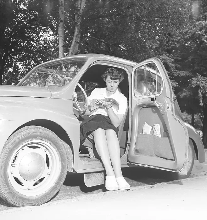 Framed Print : In the 1950s. A woman in the drivers seat of a small car reading a book. 1950 Kristoffersson ref AZ65-6 Framed Print : In the 1950s. A woman in the drivers seat of a small car reading a book. 1950 Kristoffersson ref AZ65-6