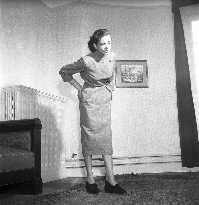 Framed Print : In the 1950s. A young woman holds her hands on her lower back and looks as she is having pain from that part of her body. Sweden 1951 ref BB81-10