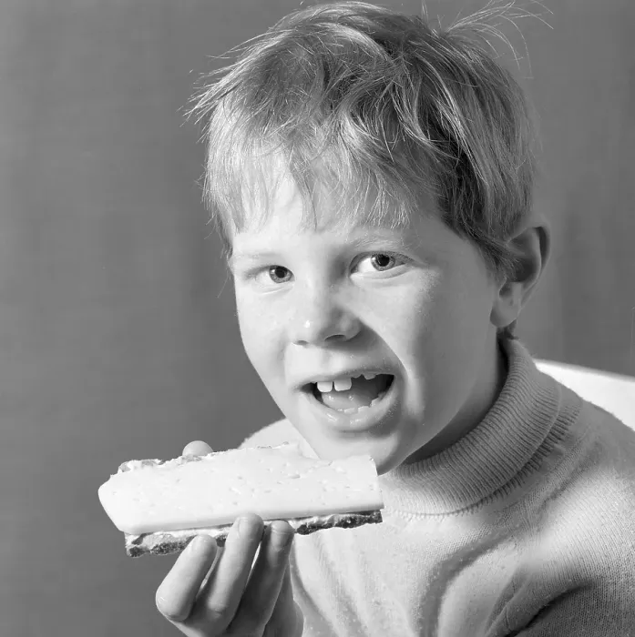Framed Print : In the 1960s. A boy is eating a cheese sandwich. 1969. Conard ref 5818