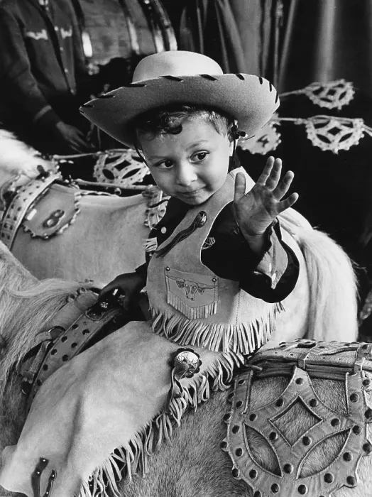 Framed Print : In the 1960s. A boy on a horse dressed in cowboy clothes and hat Framed Print : In the 1960s. A boy on a horse dressed in cowboy clothes and hat