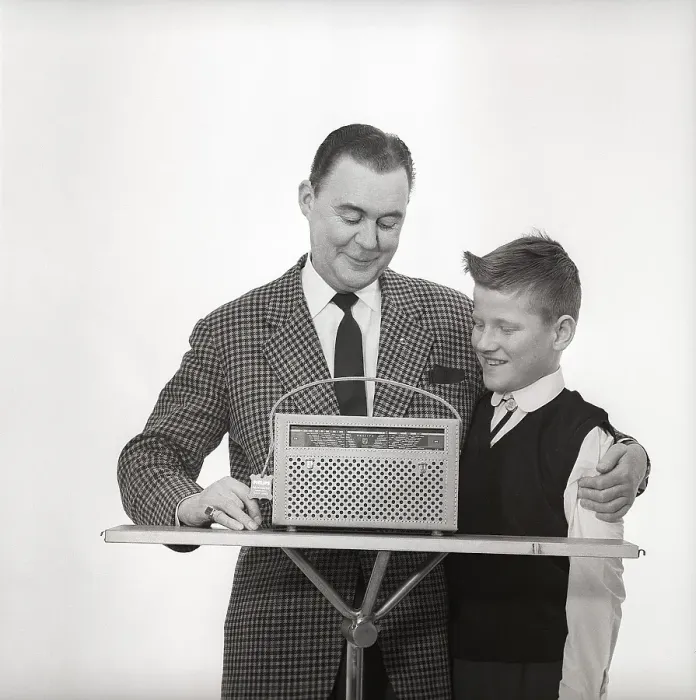 Framed Print : In the 1960s. Father and son with a radio Framed Print : In the 1960s. Father and son with a radio