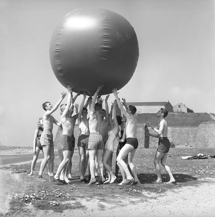 Framed Print : 1960s fun in the sun. A group of teenagers play on this sunny day