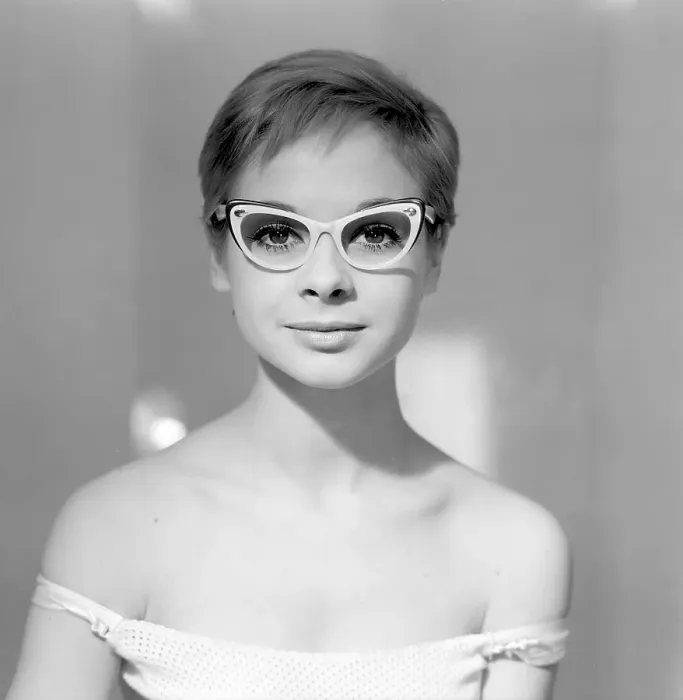 Framed Print : 1960s glasses. A young woman in glasses and bows January 1961
