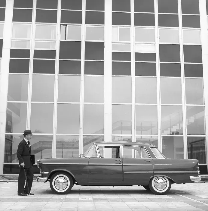 Framed Print : In the 1960s. A man is seen standing at his car