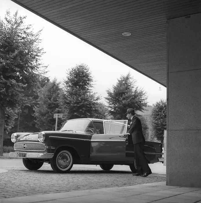 Framed Print : In the 1960s. A man is seen standing at his car Framed Print : In the 1960s. A man is seen standing at his car