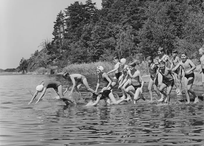 Framed Print : 1960s summer. It's a sunny summer day and the children are running into the water Framed Print : 1960s summer. It's a sunny summer day and the children are running into the water